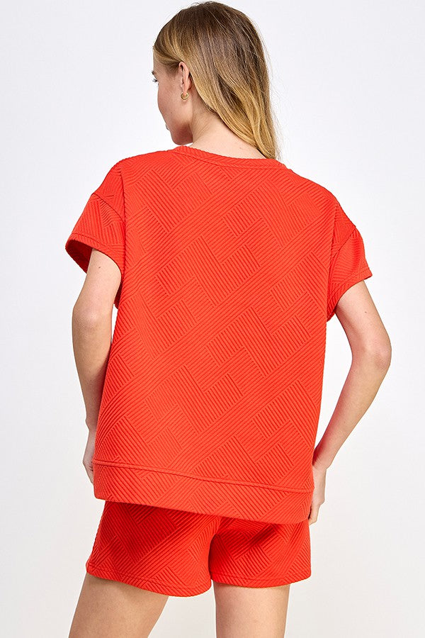 See and Be Seen Luxe Travel Top- tomato red, short sleeves, rounded neck, textured, curvy